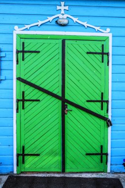 green door of church of St. Paraskeva in Divin
