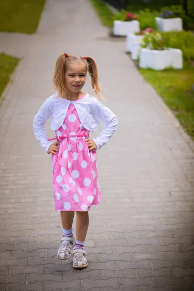 Little girl is walking on path — Stock Photo, Image