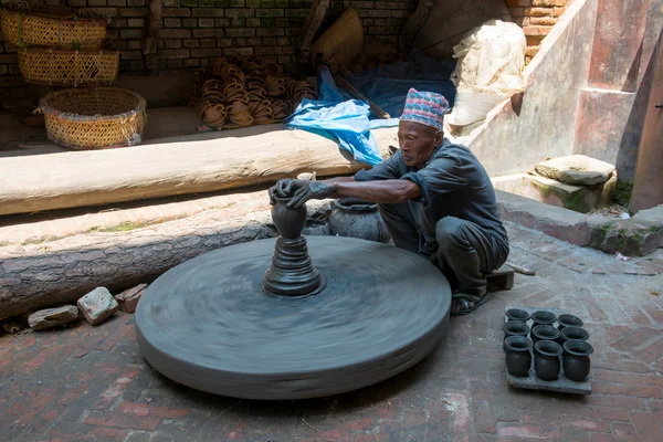 Unidentified pottery man — Stock Photo, Image