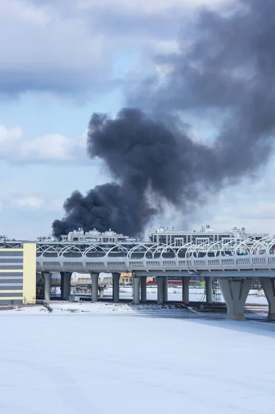 View of the fire over houses in Saint-Petersburg, Russia