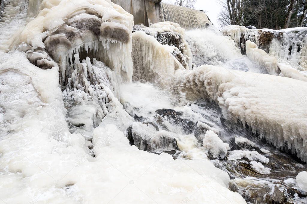 Partly frozen Keila-Joa waterfall in winter near Tallinn, Estonia