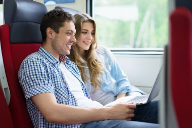 Young couple in train clipart