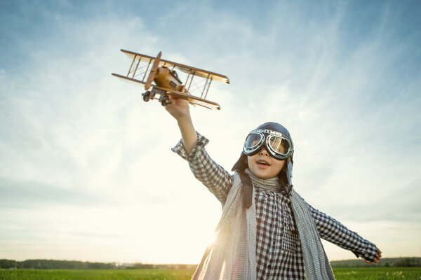 Smiling boy with airplane