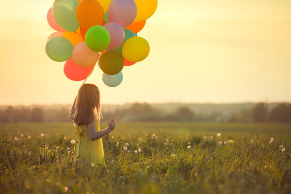 Little girl with balloons