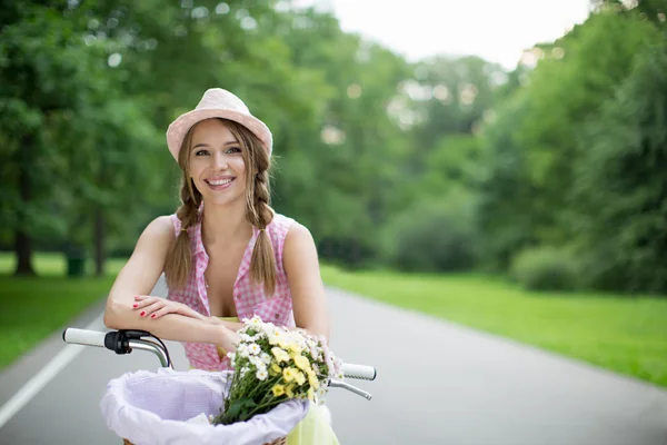 Young girl on a bicycle — Stock Photo, Image