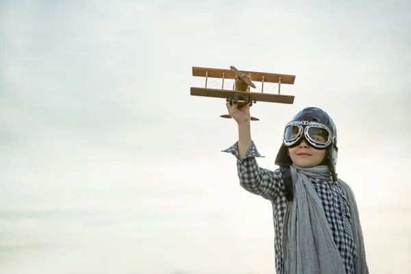 Little boy with airplane — Stock Photo, Image