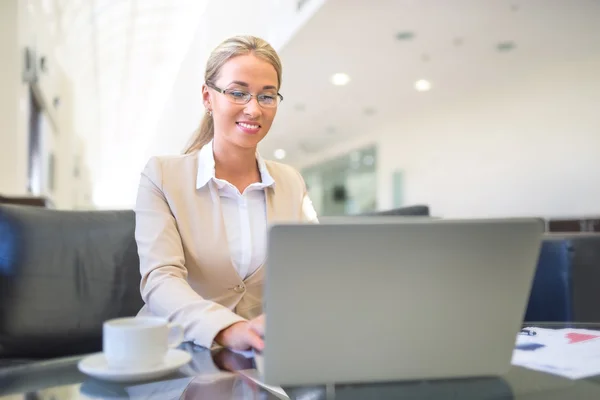 Smiling manager with laptop — Stock Photo, Image