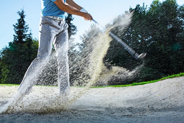 Golfer with club outdoors — Stock Photo, Image