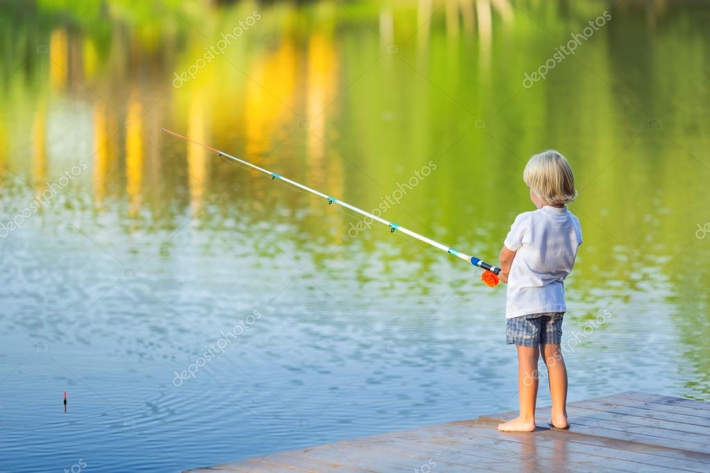 Little boy fishing — Stock Photo © Deklofenak #111010502