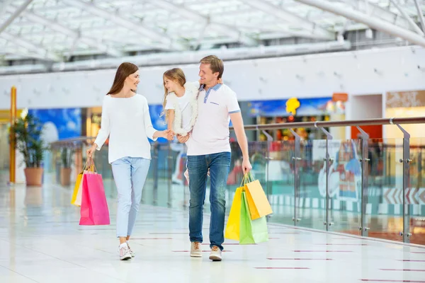 Smiling family in shop — Stock Photo, Image