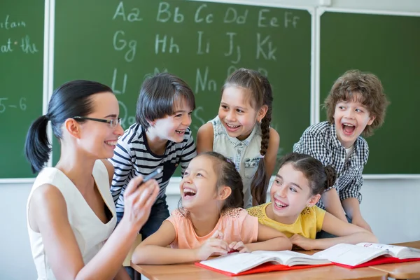 Happy childen in classroom — Stock Photo, Image