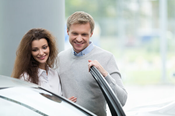 Young couple with car