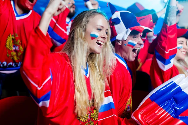 Smiling woman in stadium — Stock Photo, Image