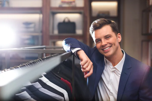 Smiling businessman in shop — Stock Photo, Image