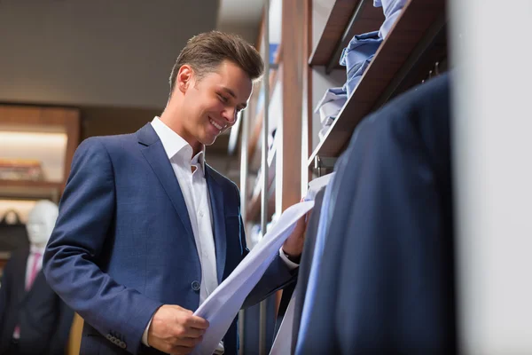 Happy businessman in shop — Stock Photo, Image