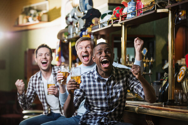 Happy men in pub