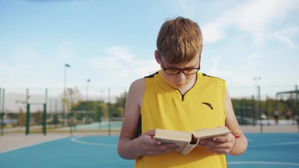 Young Boy Book Calculating Outdoors — Stock Video