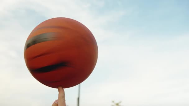 Young Man Spinning Ball Outdoors Close — Vídeos de Stock