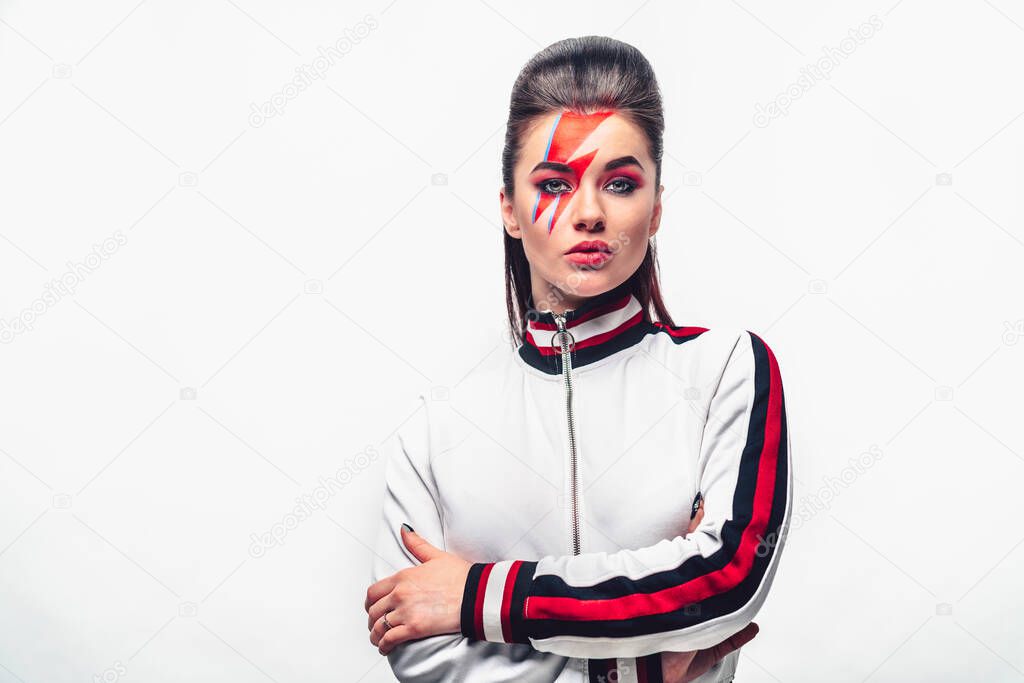 Portrait of a beautiful girl with make-up in the studio