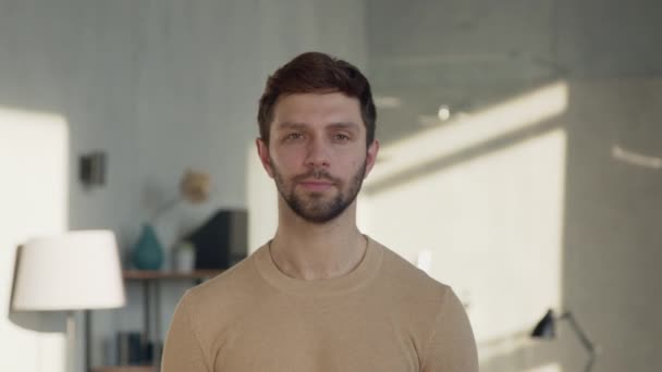 Portrait of a young smiling man looking at camera, slow motion concept. Young professional man looking at camera — Stock Video