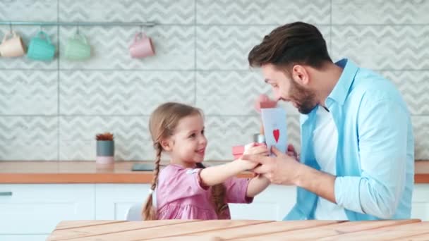 Little preschool girl giving gifts to her dad for fathers day. — Stock Video