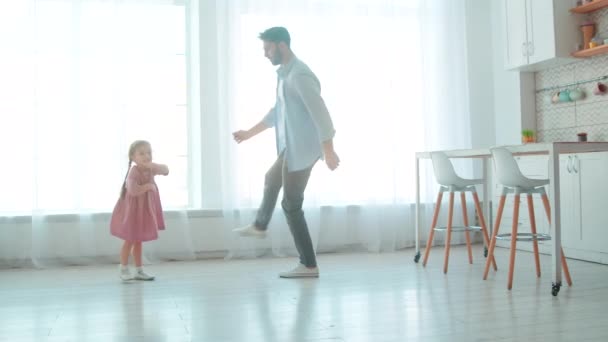 Dad and daughter spending time together at home. Lifestyle slow motion concept. Cute princess and her daddy in the room — Stock Video