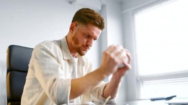 Concentrated financial company manager shakes piggy bank