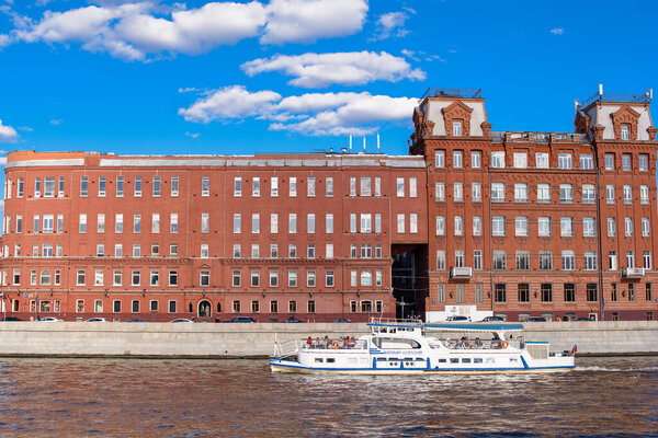 MOSCOW, RUSSIA - MAY 1, 2021: Navigation on the Moscow River with a view of the Krasny Oktyabr factory on Balchug Island