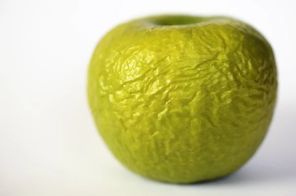Contracted green dry apple — Stock Photo, Image