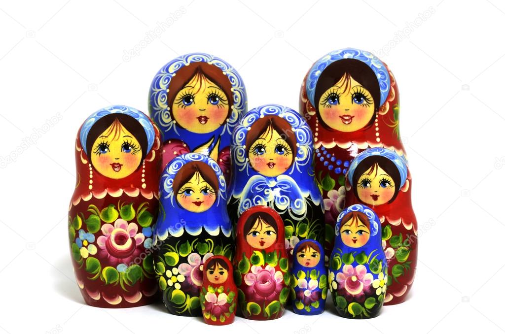 lot of traditional Russian matryoshka dolls on white
