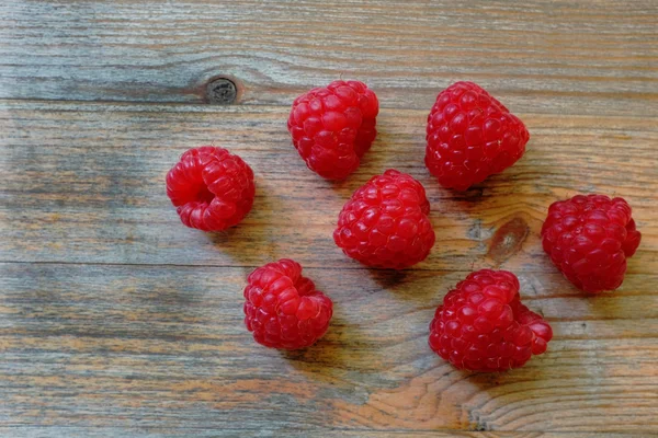 Fresh red berries Raspberry European on a wooden surface — Stock Photo, Image