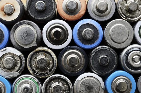 Lot of old used batteries — Stock Photo, Image