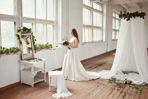 stock image Beautiful bride portrait in wedding dress near window