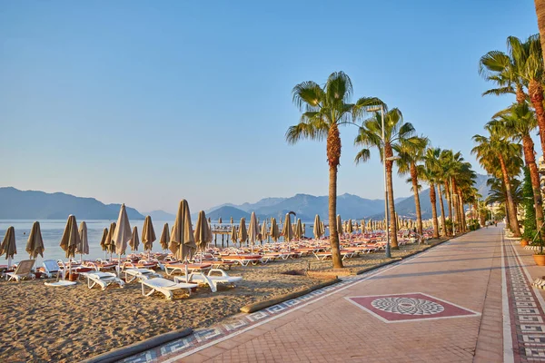 Sandy Beach People Sun Loungers Folded Umbrellas Palm Trees Turkey Royalty Free Stock Photos