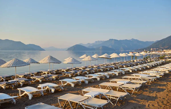 Sandy Beach People Sun Loungers Umbrellas Palm Trees Marmaris Turkey Stock Photo