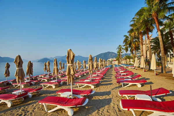 Sandy Beach People Sun Loungers Umbrellas Palm Trees Marmaris Turkey Royalty Free Stock Images