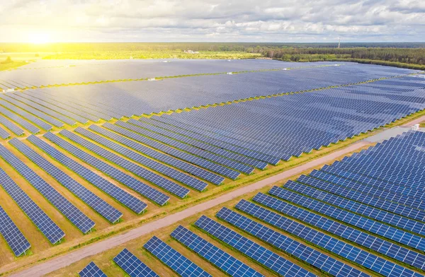 Solar power plant in the field. Aerial view of Solar panels. Solar farm. The source of ecological renewable energy.