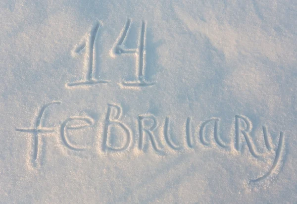 La palabra 14 de febrero dibujar en la nieve —  Fotos de Stock