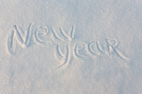 Gott nytt år skrivit på snö — Stockfoto