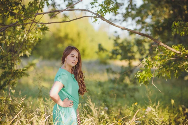 Candid skipping carefree adorable woman in field — Stock Photo, Image