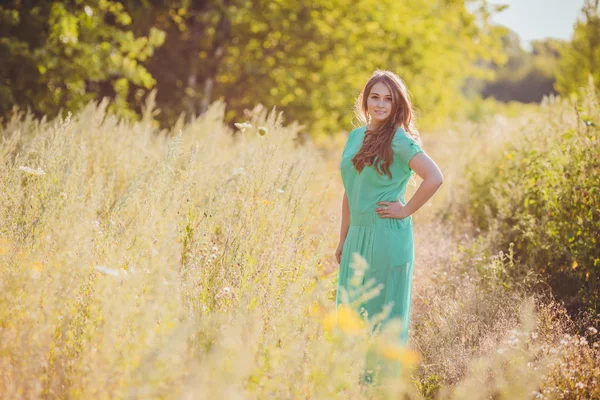 Candid skipping carefree adorable woman in field — Stock Photo, Image