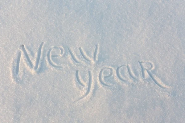 Gott nytt år skrivit på snö — Stockfoto