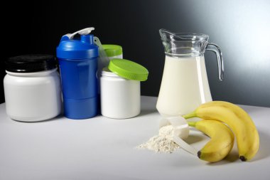 Sport Nutrition Supplement containers with jug of milk clipart