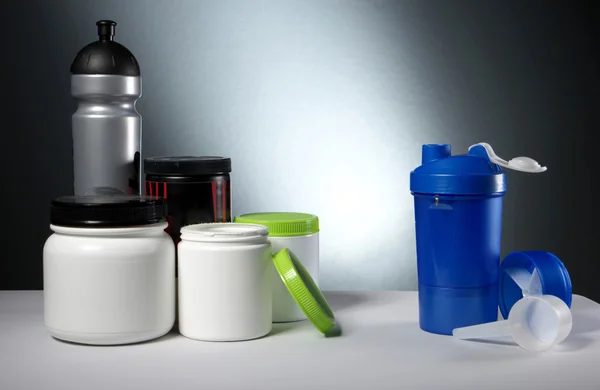 Sport Nutrition Supplement containers with shaker — Stock Photo, Image