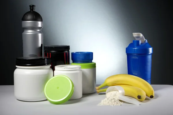 Sport Nutrition Supplement containers with shaker — Stock Photo, Image