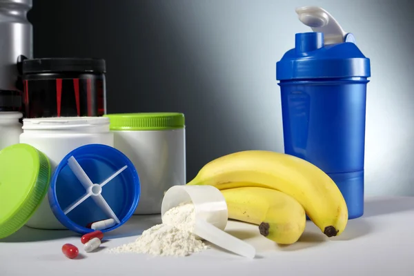 Sport Nutrition Supplement containers with shaker — Stock Photo, Image