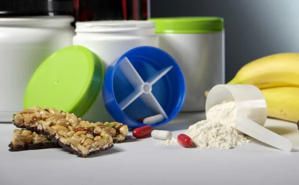 Sport Nutrition Supplement containers with pills — Stock Photo, Image