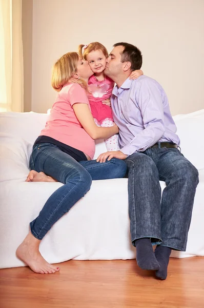 Young pregnant woman, with husband and little daughter — Stock Photo, Image