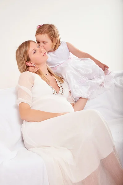 Young pregnant woman with little daughter — Stock Photo, Image