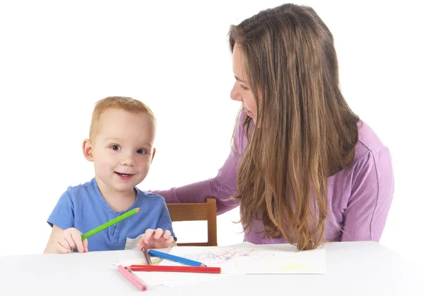 Mother and son are drawing the picture together Stock Image
